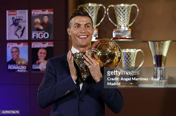 Cristiano Ronaldo of Real Madrid poses with the Ballon D'Or 2016 trophy at Estadio Santiago Bernabeu on December 12, 2016 in Madrid, Spain.