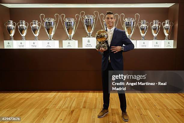 Cristiano Ronaldo of Real Madrid poses with the Ballon D'Or 2016 trophy at Estadio Santiago Bernabeu on December 12, 2016 in Madrid, Spain.