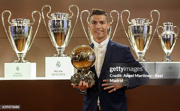 Cristiano Ronaldo of Real Madrid poses with the Ballon D'Or 2016 trophy at Estadio Santiago Bernabeu on December 12, 2016 in Madrid, Spain.