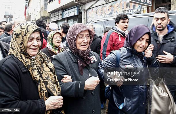 People on December 12, 2016 during police chief Kadir Yildirim's funeral, who was killed on December 10 blasts in Istanbul. The death toll from the...