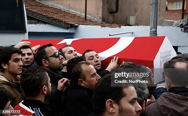 People carry the coffin of police chief Kadir Yildirim, who was killed in December 10, 2016 twin bombings in Istanbul, during his funeral ceremony in...