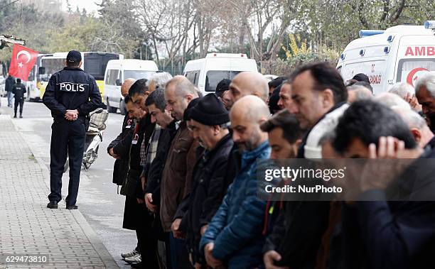 People on December 12, 2016 during police chief Kadir Yildirim's funeral, who was killed on December 10 blasts in Istanbul. The death toll from the...