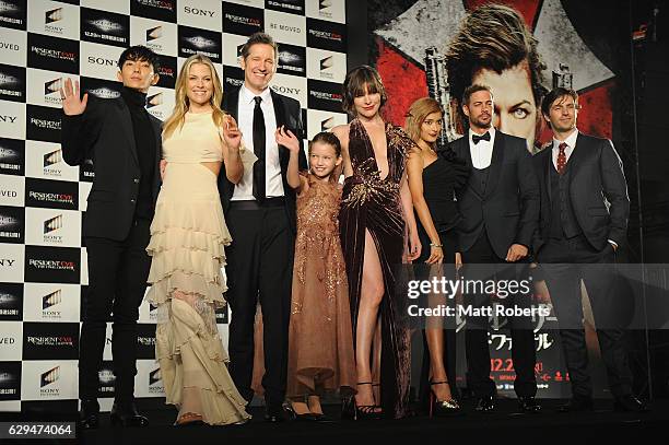 Milla Jovovich speaks on poses on stage with cast at the world premiere of 'Resident Evil: The Final Chapter' at the Roppongi Hills on December 13,...