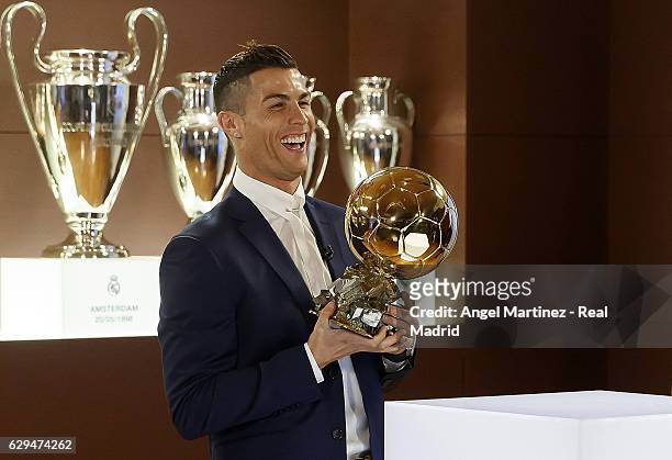 Cristiano Ronaldo of Real Madrid poses with the Ballon D'Or 2016 trophy at Estadio Santiago Bernabeu on December 12, 2016 in Madrid, Spain.