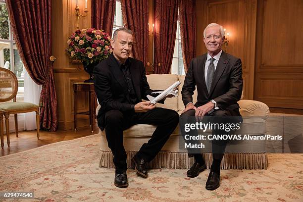 Actor Tom Hanks with retired commercial pilot Chesley Sullenberger are photographed for Paris Match on November 18, 2016 in Paris, France.