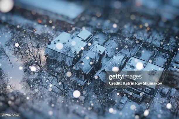 snowy fairy tale in miniature town - snow globe stock-fotos und bilder