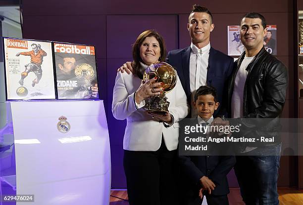 Cristiano Ronaldo of Real Madrid with his mother Maria Dolores dos Santos , his son Cristiano Ronaldo Jr. And his brother Hugo Aveiro pose with the...