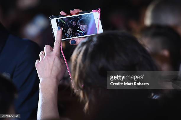 Milla Jovovich takes a selfie with a fan at the world premiere of 'Resident Evil: The Final Chapter' at the Roppongi Hills on December 13, 2016 in...
