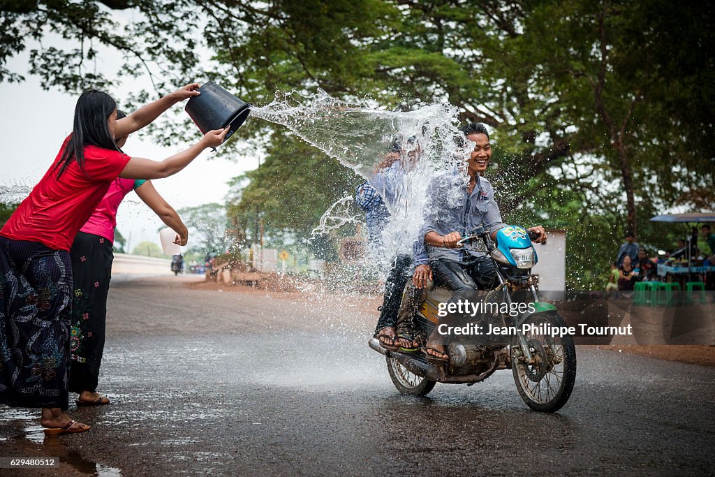 Splashed People Young People Being Splashed By Water While Riding A Motorbike On The ...