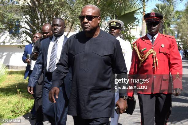 President of Ghana John Dramani Mahama arrives at a hotel in Banjul on December 13 for a meeting with regional West African leaders in a bid to...