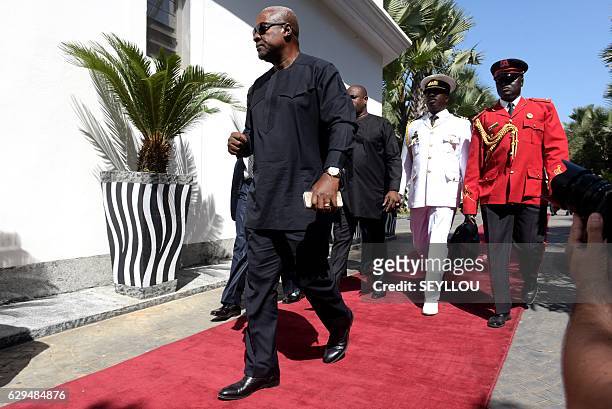 President of Ghana John Dramani Mahama arrives at a hotel in Banjul on December 13 for a meeting with regional West African leaders in a bid to...