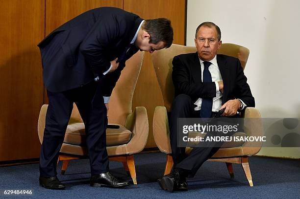 Serbian Foreign Minister Ivica Dacic takes his seat next to Russian Foreign Minister Sergey Lavrov during a press conference after the BSEC session...