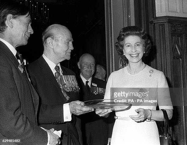 Sir John Smyth , President of the Victoria Cross and George Cross Associations, presents a 50th birthday gift to Queen Elizabeth II. The Queen gave a...
