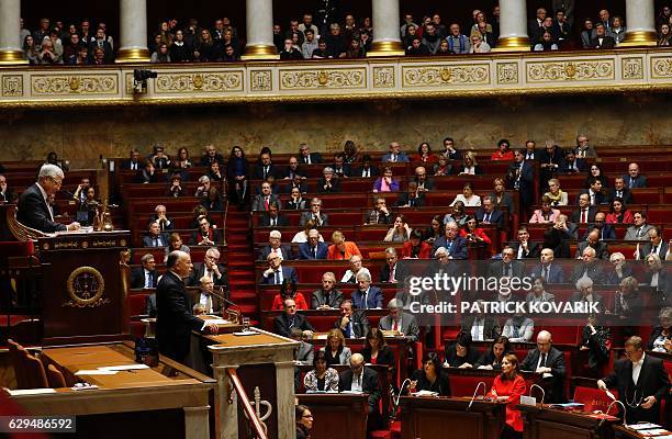 French Prime Minister Bernard Cazeneuve delivers his first policy speech next to French Assembly President Claude Bartolone at the National Assembly...