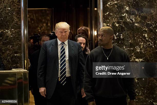 President-elect Donald Trump and Kanye West exit an elevator and walk into the lobby at Trump Tower, December 13, 2016 in New York City....