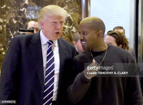 Singer Kanye West and President-elect Donald Trump arrive to speak with the press after their meetings at Trump Tower December 13, 2016 in New York.