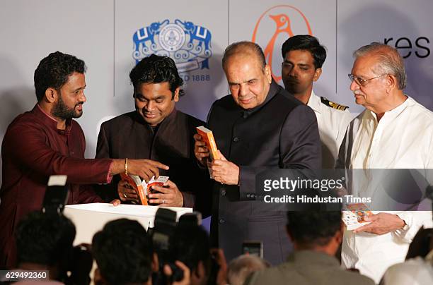 Film sound designer Resul Pookutty, AR Rahman , Governor K. Sankaranarayanan and Gulzar at the release of Pookuttys autobiography in Malayalam...
