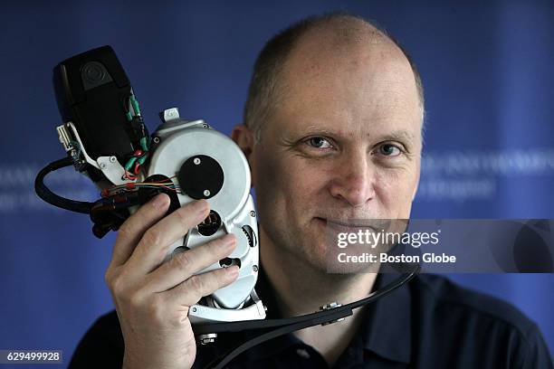 Jim Ewing with the robotic prosthetic at Brigham and Womens Faulkner Hospital in Boston on Nov. 20, 2016. After a fall while rock climbing, Ewing...