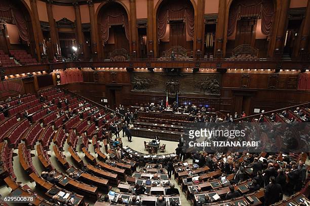 Picture shows empty seats at the Italian Chamber of Deputies as Five Star Movement deputies and far-right party Lega Nord deputies leave the...