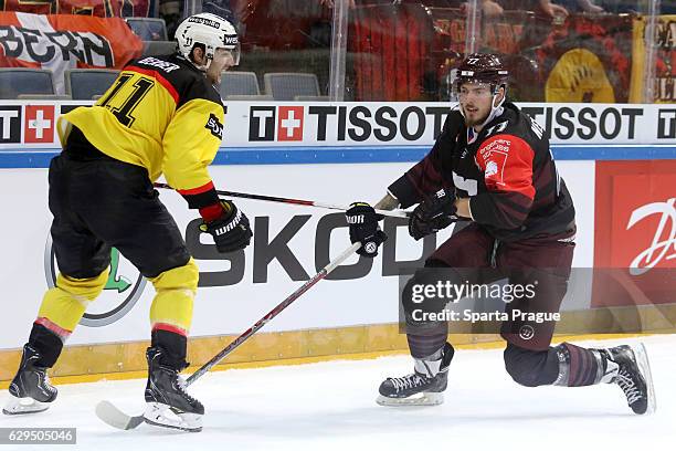 Richard Nedomlel of HC Sparta Prague challenges Alain Berger of Bern during the Champions Hockey League Quarter Final match between Sparta Prague and...