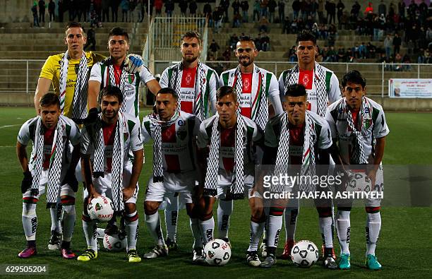Players from Chile´s Club Deportivo Palestino pose for a picture before a friendly football match against the Palestinian national football team in...