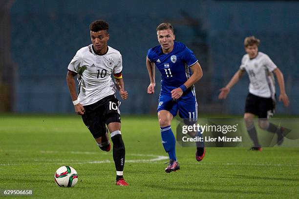 Timothy Tillman of Germany challenges Eden Karzev of Israel during the Under 18 International Friendly match between Israel and Germany on December...