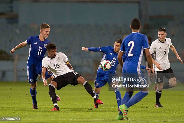 Timothy Tillman of Germany challenges Ron Zamir of Israel during the Under 18 International Friendly match between Israel and Germany on December 13,...