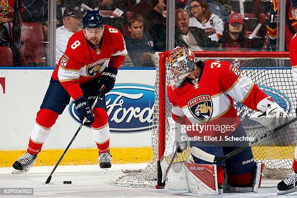 Goaltender James Reimer of the Florida Panthers in net during warm ups while teammate Dylan Mcllrath skates with a puck against the Vancouver Canucks...