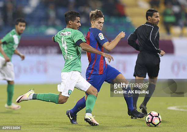 Denis Suarez of Barcelona tackled by Waleed Bakhween of Al-Ahli Saudi FC during the Qatar Airways Cup match between FC Barcelona and Al-Ahli Saudi FC...