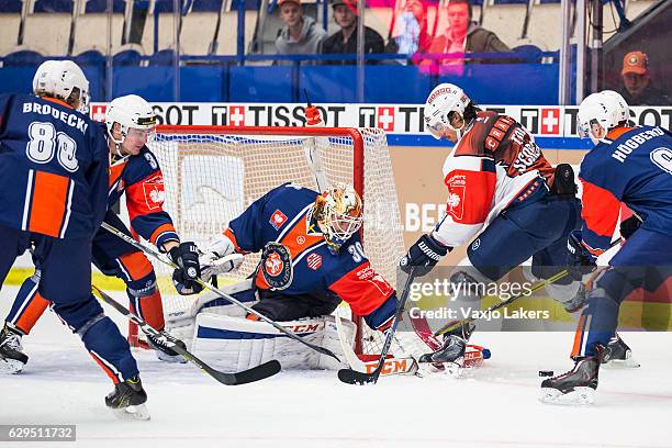 Roman Wick of ZSC Lions Zurich challenges Joacim Andersson Goaltender of Vaxjo Lakers during the Champions Hockey League Quarter Final match between...