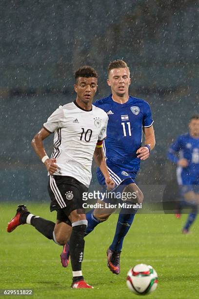 Timothy Tillman of Germany challenges Eden Karzev of Israel during the Under 18 International Friendly match between Israel and Germany on December...