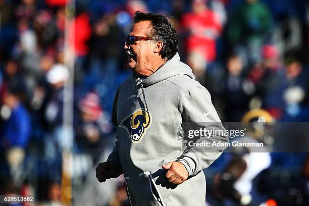 Head coach Jeff Fisher of the Los Angeles Rams walks on the field before the game against the New England Patriots at Gillette Stadium on December 4,...