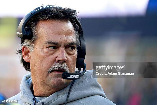 Head coach Jeff Fisher of the Los Angeles Rams looks on during the first half against the New England Patriots at Gillette Stadium on December 4,...