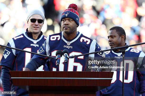 Lawyer Milloy of the New England Patriots' 2001 Super Bowl winning team is honored along with his teammates Drew Bledsoe and Troy Brown along with...