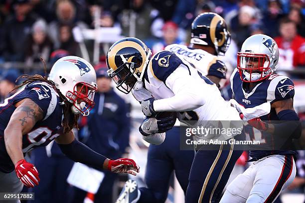 Jabaal Sheard of the New England Patriots tackles Brian Quick of the Los Angeles Rams during the game at Gillette Stadium on December 4, 2016 in...