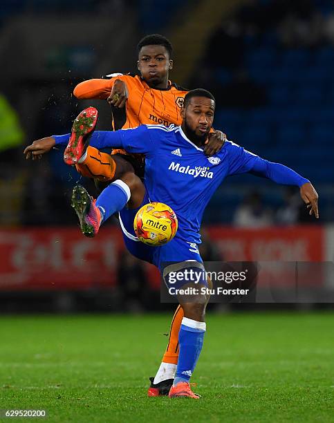 Wolves player Dominic Iorfa challenges Junior Hoilett of Cardiff during the Sky Bet Championship match between Cardiff City and Wolverhampton...