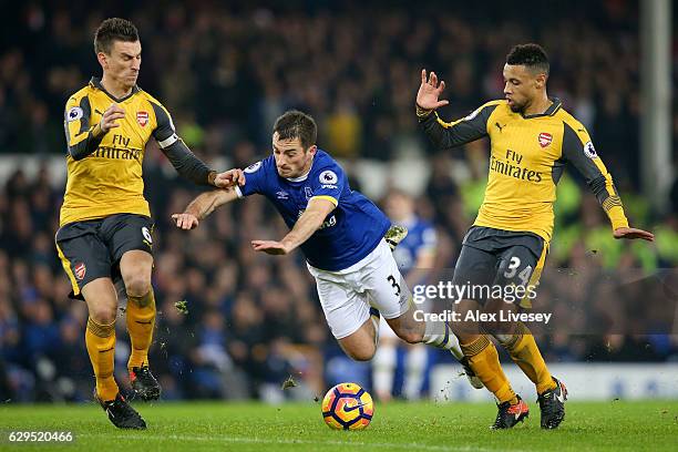 Leighton Baines of Everton is brought down by Francis Coquelin of Arsenal during the Premier League match between Everton and Arsenal at Goodison...