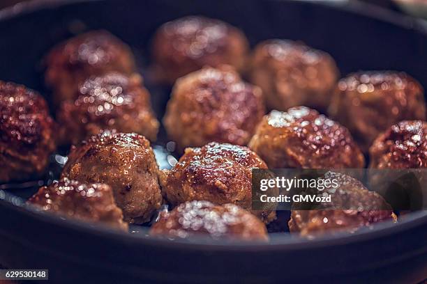 delicious roasted meatballs in a pan - meatball imagens e fotografias de stock