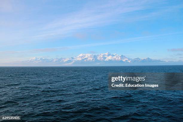 Pacific Ocean, distant mountains, Glacier Bay National Park, Alaska.