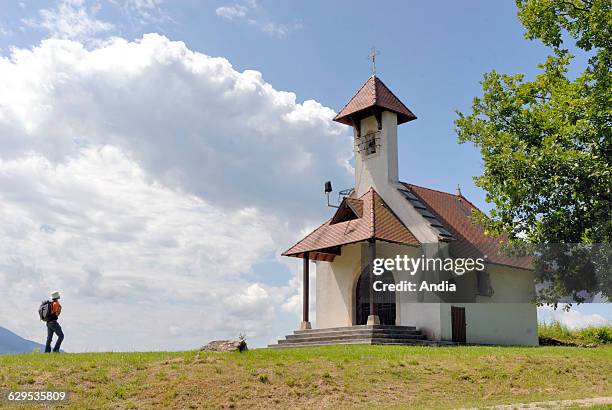 Pilgrims at the Chapel of Saint Romain near Jongieux-le-Haut , Rhone river valley, Savoie department , Rhone-Alpes region, France. Way of St James...