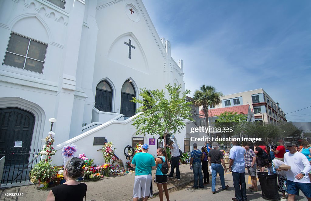 Famous Emanuel A.M.E. Church in Charleston South Carolina people leaving flowers and messages at scene of murder of 9 people
