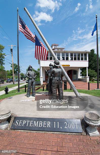 Brockport New York NY small town with Ground Zero Statue for 9/11 fire fighters hero memorial with USA flag at the Fire Museum in Brockport.