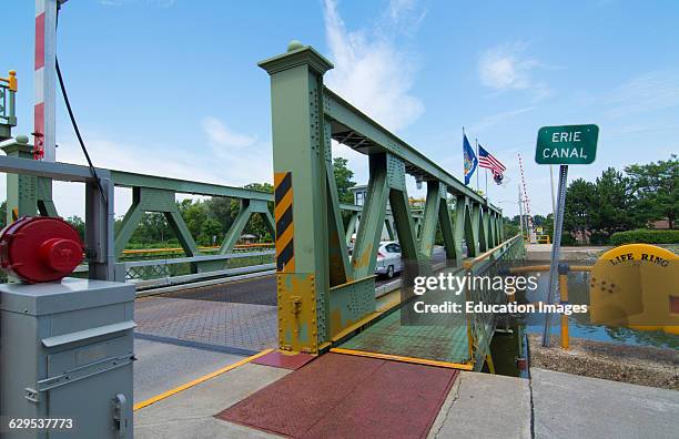 Brockport New York NY small town with famous historical Erie Canal with bridge over water for cars.