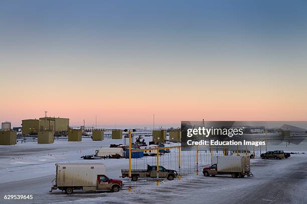 Oil wells and truck charging station at dawn in Deadhorse Prudhoe Bay Beaufort Sea Arctic Ocean Alaska.