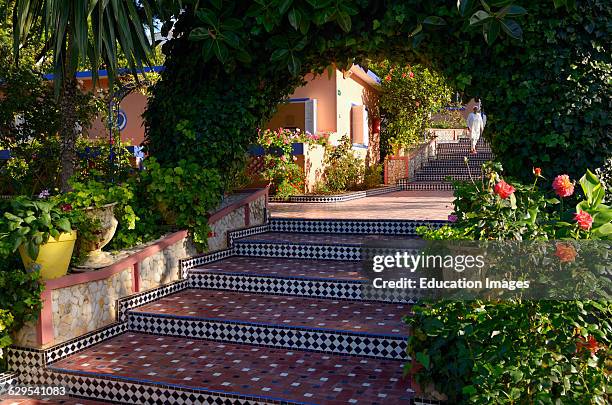 Tiled steps and tropical gardens at Hippocampe resort Oualidia Morocco.