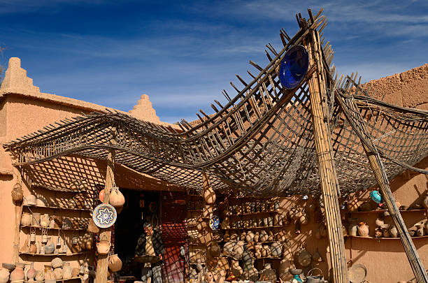 Pottery shop with wavy roof next to the Ait Ben Moro Kasbah in Skoura Morocco.
