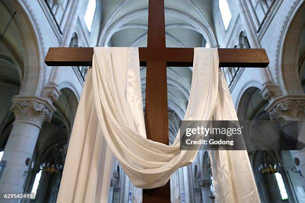 Saint Ambroise church. Holy week. The cross and the white cloth symbolize the resurrection of Jesus.