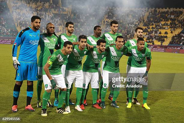 Players of Al-Ahli Saudi pose for a photo after a friendly soccer match between Al-Ahli Saudi and Barcelona at Al-Gharrafa Stadium in Doha, Qatar on...