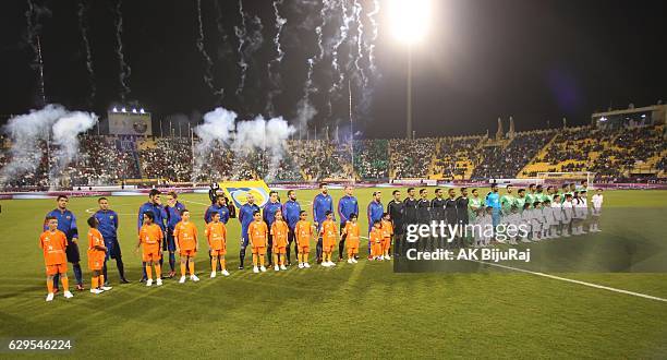 Teams line up during the Qatar Airways Cup match between FC Barcelona and Al-Ahli Saudi FC on December 13, 2016 in Doha, Qatar.