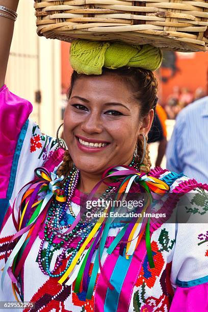 Traditionally Dressed Mexican Woman In A Parade During The July Guelaguetza Festival, Oaxaca, Mexico.